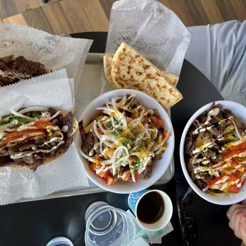 Avi Cue - (Left to right) 2x half pitas, loaded fries, plate of wagyu shawarma - Middle Eastern Near Me - Los Angeles, California Avi Cue - (Left to right) 2x half pitas, loaded fries, plate of wagyu shawarma - Middle Eastern Near Me - Los Angeles, California