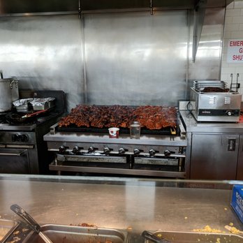 QDOBA Mexican Eats - Open kitchen. Grill full of meat. - Mexican Near Me - Detroit, Michigan