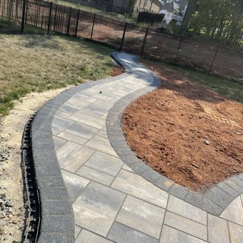 Green Oasis Environmental - Paver walk way - Lawn Services Near Me