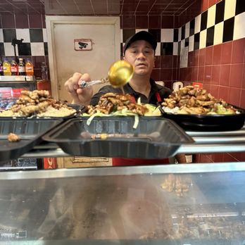 Security Square Mall - Putting extra sauce on orders - Shopping Centers Near Me - Baltimore, Maryland