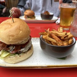 Chesterfield - Burger with fried pineapple, provolone cheese, and bacon. In the back is a PB&J burger with tots.