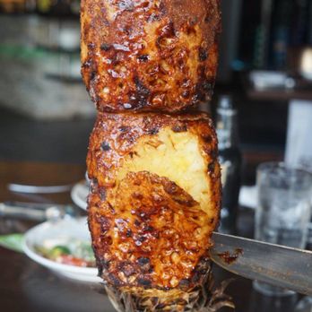 Fumaca Brazilian Steakhouse - a piece of meat on a skewer - Steakhouses Near Me - Edmonton, Alberta