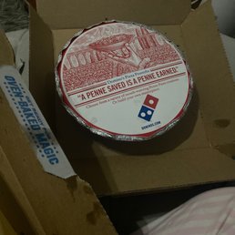 a pizza in a cardboard box a pizza in a cardboard box