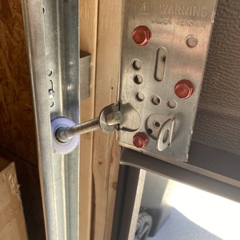 Absolute Garage Builders - Short rollers installed where long rollers should have gone causing door detachment and bent frame. - Garage Door Services Near Me - Chicago, Illinois