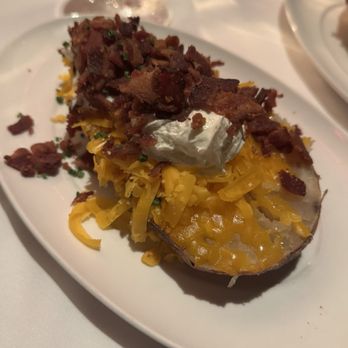 Vic & Anthony's Steakhouse - 1/2 a baked potato which I couldn't even finish - Steakhouses Near Me - Las Vegas, Nevada Vic & Anthony's Steakhouse - 1/2 a baked potato which I couldn't even finish - Steakhouses Near Me - Las Vegas, Nevada