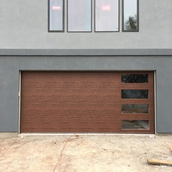Superior Garage Door Service - Modern series steel door in walnut finish