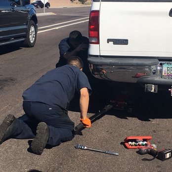 Firestone Complete Auto Care - The employees attempting to put our tire back on after the forgot to tighten the lug nuts and it popped off. - Auto Repair Near Me - Chandler, Arizona Firestone Complete Auto Care - The employees attempting to put our tire back on after the forgot to tighten the lug nuts and it popped off. - Auto Repair Near Me - Chandler, Arizona