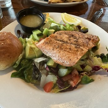 Train Wreck Bar - Cucumber avocado salad with salmon and vinaigrette dressing - Sports Bars Near Me - Burlington, Washington Train Wreck Bar - Cucumber avocado salad with salmon and vinaigrette dressing - Sports Bars Near Me - Burlington, Washington