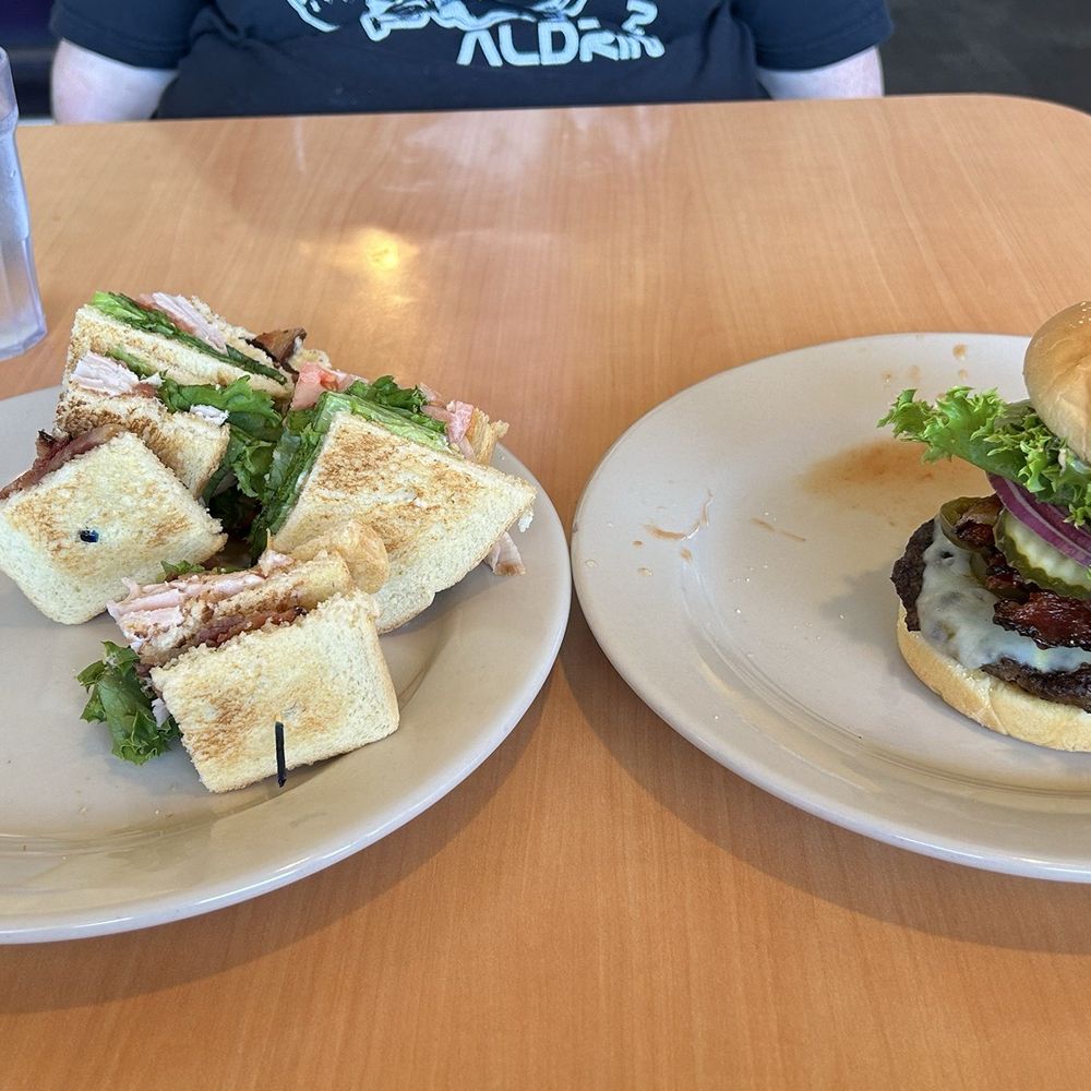 Basic food: club and burger. The best thing about this meal was the onion rings, which were delivered very late/slowly. Basic food: club and burger. The best thing about this meal was the onion rings, which were delivered very late/slowly.