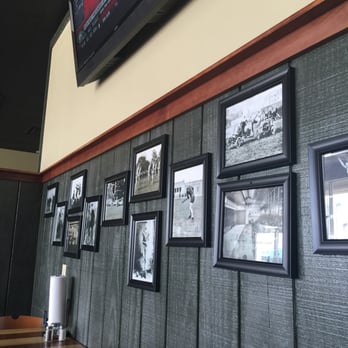 The Scoreboard - a wall full of framed photos - Chicken Wings Near Me - Monticello, Indiana The Scoreboard - a wall full of framed photos - Chicken Wings Near Me - Monticello, Indiana