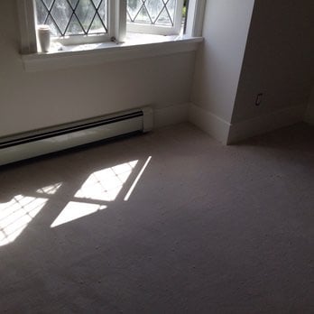 All Floors Installations - an empty room with a heater - Flooring Near Me