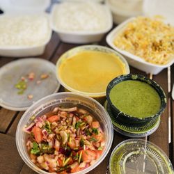 Bawarchi Biryani's - Also 3 containers of white rice one more of the Biryani rice 2 mint sauces & A Super SPICY Tomato chutney & a yellow sauce/non spicy.