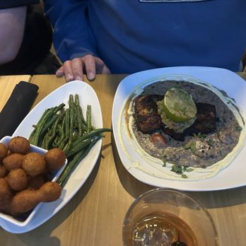 Reel Seafood Grill - Mahi Mahi with hush puppies and green beans - Seafood Near Me - Greensboro, North Carolina Reel Seafood Grill - Mahi Mahi with hush puppies and green beans - Seafood Near Me - Greensboro, North Carolina