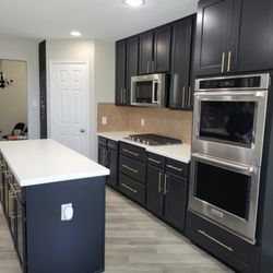 Premier Image Roofing & Construction - New cabinets remodeled and new hardware installed.