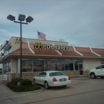 McDonald's - a white car parked in front of a mcdonald's - Burgers Near Me - Arlington, Texas McDonald's - a white car parked in front of a mcdonald's - Burgers Near Me - Arlington, Texas