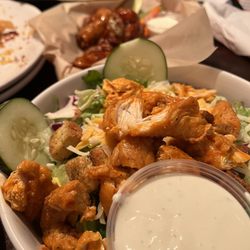 Uptown Charlie's - Buffalo chicken salad. In the background hot teriyaki wings