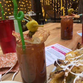 Happy Camper - bloody mary and pulled pork nachos - Bars Near Me - Chicago, Illinois Happy Camper - bloody mary and pulled pork nachos - Bars Near Me - Chicago, Illinois