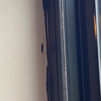 Storm Tight Windows - Shows the sloppy caulking. - Windows Installation Near Me - Deerfield Beach, Florida Storm Tight Windows - Shows the sloppy caulking. - Windows Installation Near Me - Deerfield Beach, Florida