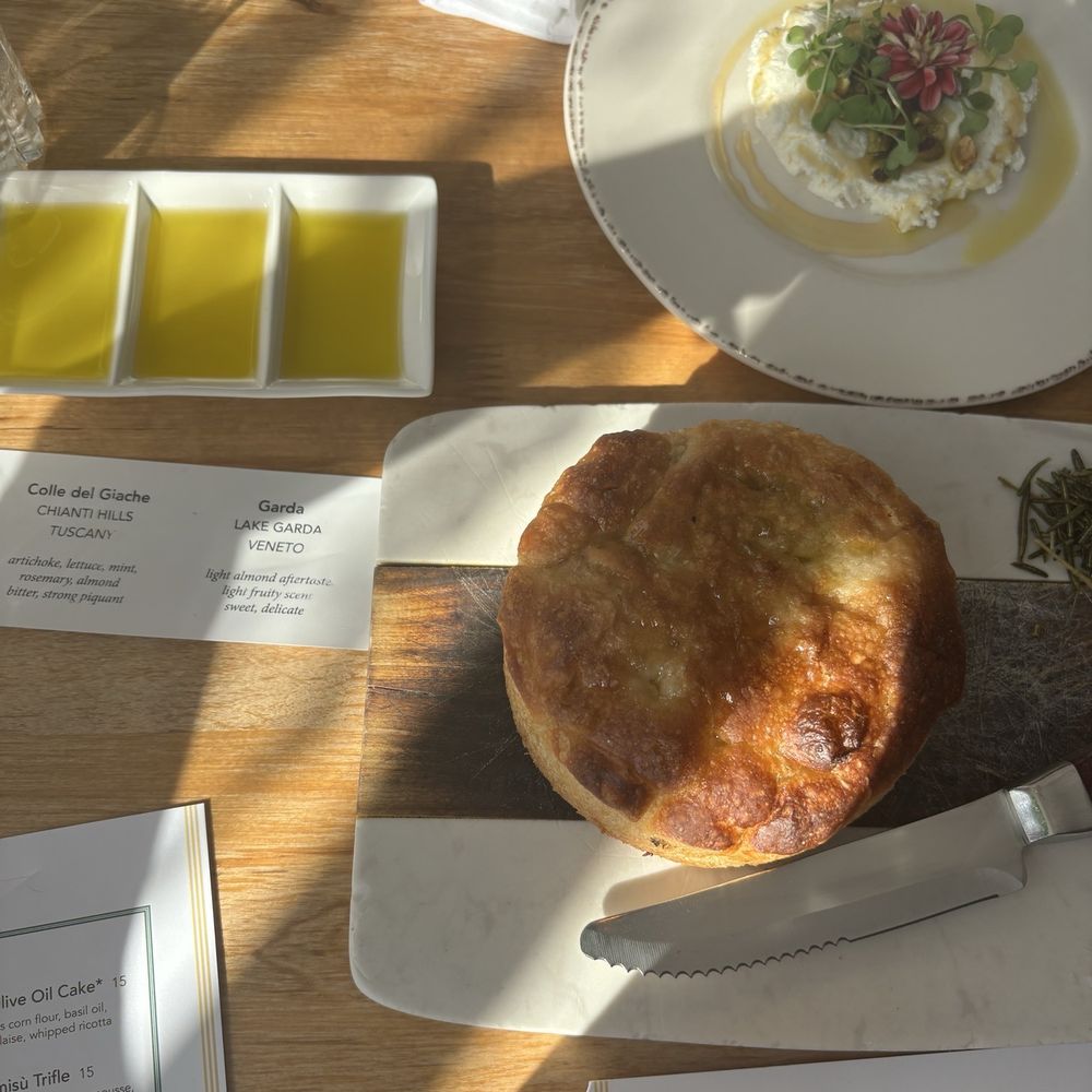 Ever Andalo - Focaccia appetizer with olive oil flight and ricotta with honey and pistachios - Italian Near Me - Charlotte, North Carolina Ever Andalo - Focaccia appetizer with olive oil flight and ricotta with honey and pistachios - Italian Near Me - Charlotte, North Carolina
