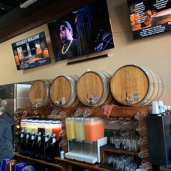 Whiskey Hollow - a man and woman at a bar - Distilleries Near Me - Valley View, Texas