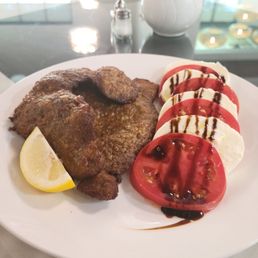Lunch portion of Milanese with caprese salad