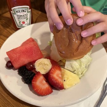 Pie 'n Burger - Kids Jr Cheeseburger with fruit (6 year old hands for scale) - Burgers Near Me - Pasadena, California Pie 'n Burger - Kids Jr Cheeseburger with fruit (6 year old hands for scale) - Burgers Near Me - Pasadena, California
