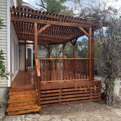 Landmark Fence and Deck - Cedar deck with pergola cover. Stained with Ready Seal