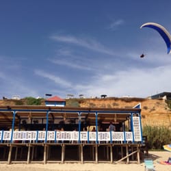 El Coto - Hang-glider above El Coto beach bar