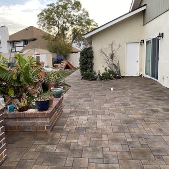 Thunder Masonry & Pavers - Side yard with a ramp to the sliding door - Landscaping Near Me