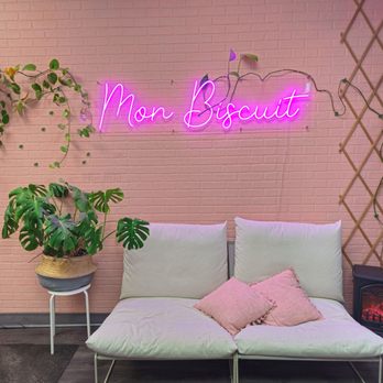 Mon Biscuit - a white couch and a pink neon sign - Desserts Near Me - Brossard, Quebec Mon Biscuit - a white couch and a pink neon sign - Desserts Near Me - Brossard, Quebec