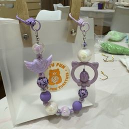 Dangly beaded cell phone holder. Dangly beaded cell phone holder.