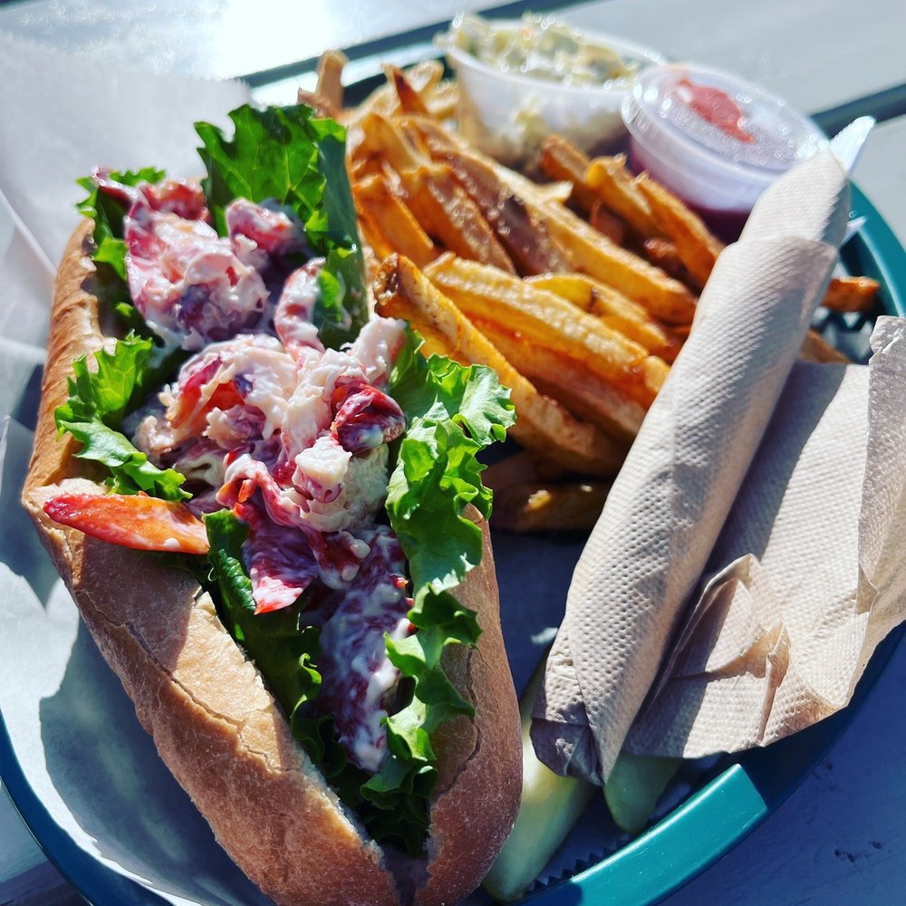 Lobster roll w/fries, slaw, and pickle Lobster roll w/fries, slaw, and pickle