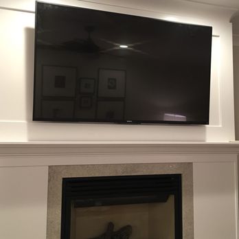 Busy As A B Property Caretakers - a flat screen tv above a fireplace - Landscaping Near Me Busy As A B Property Caretakers - a flat screen tv above a fireplace - Landscaping Near Me