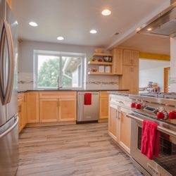 Cutting Edge Kitchen And Bath - This kitchen received a complete makeover from floor to ceiling with new tile, countertops, cabinets, sink, appliances and backsplash.