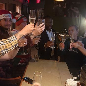 Fairway Cigar Lounge - a group of people toasting - Lounges Near Me - Melbourne, Florida