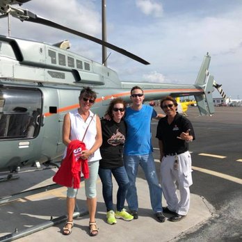 Paradise Helicopters - Our pilot on the right and us after the tour. - Aerial Tours Near Me - Kailua Kona, Hawaii Paradise Helicopters - Our pilot on the right and us after the tour. - Aerial Tours Near Me - Kailua Kona, Hawaii