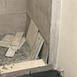 JTS Remodeling & Restoration - Tile he put in place but did not mortar. Shower was supposed done