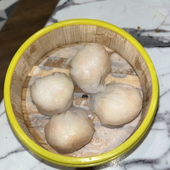 Moon Kee - a yellow bowl filled with dumplings - Cantonese Near Me - New York, New York