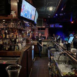 a woman sitting at the bar