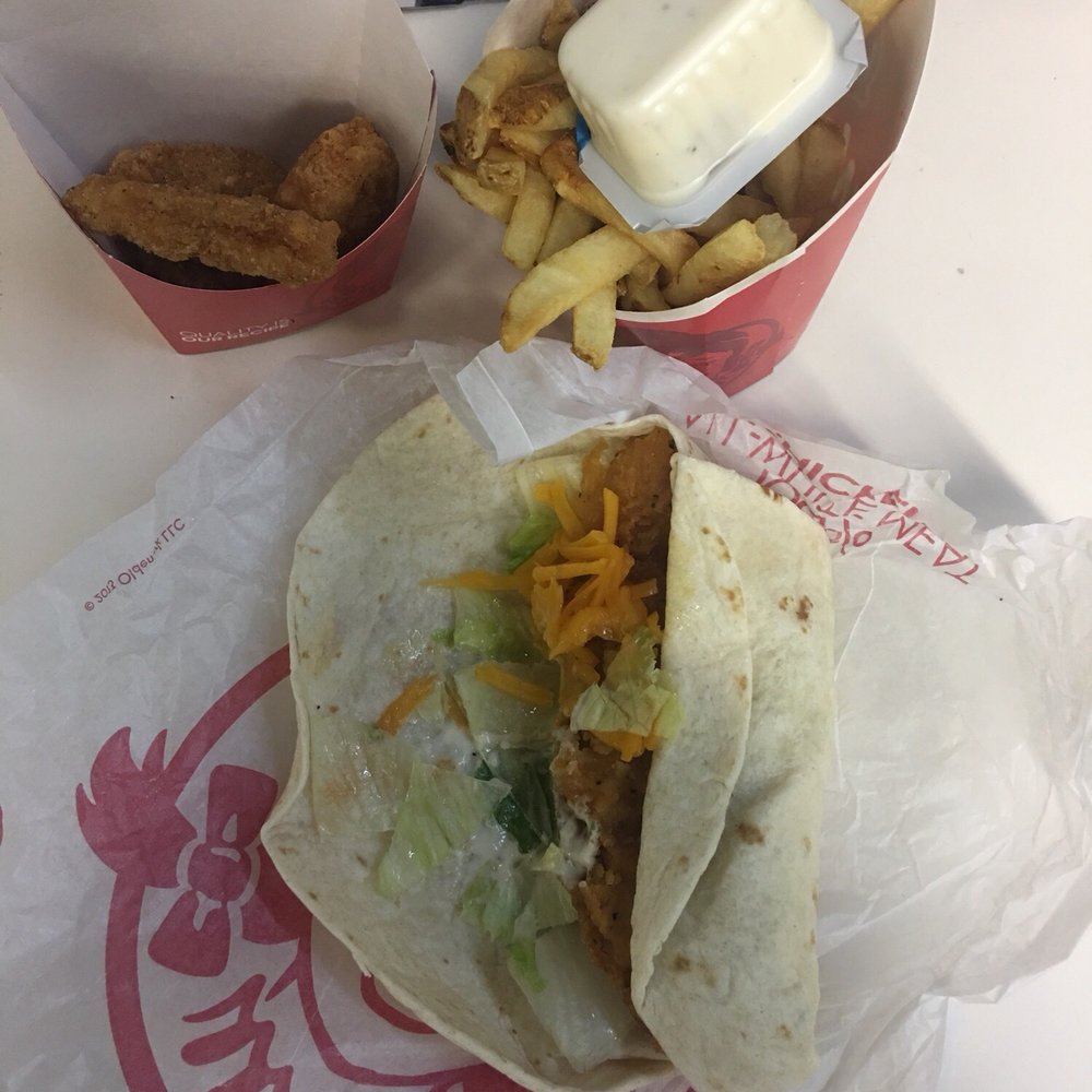a taco and fries on a table