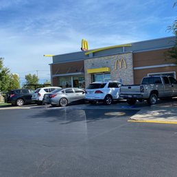 cars parked in front of a mcdonald's