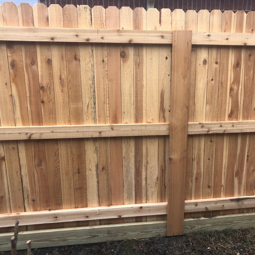 The common share fence with the 2x6 treated footer to prevent the deterioration of the bottom of the cedar wood pickets. A closer view. The common share fence with the 2x6 treated footer to prevent the deterioration of the bottom of the cedar wood pickets. A closer view.