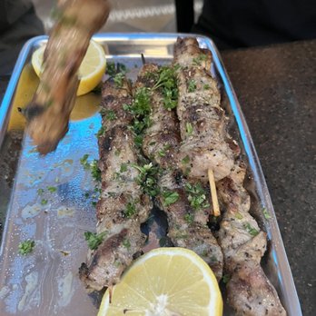 Karellas Cafe - Pork souvlaki. They were so good they couldn't stay on the plate, literally - Greek Near Me - Baltimore, Maryland