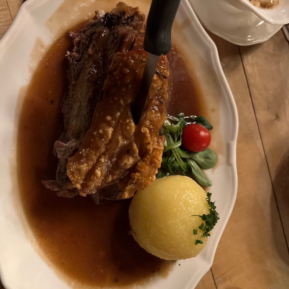 Pork shoulder with a potato ball .. Delicious !!!
