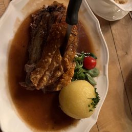 Pork shoulder with a potato ball .. Delicious !!!
