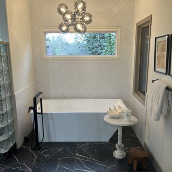 Zebu Renovations LLC - a bathtub in a bathroom - General Contractors Near Me