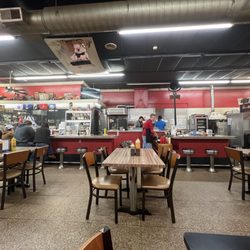 Inside dining with open kitchen view - The haze here is not a dirty camera, but rather heavy smoke that the picture does not do justice