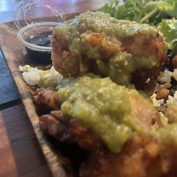 Rice breaded chicken thighs with salsa verde wasabi sauce. Rice breaded chicken thighs with salsa verde wasabi sauce.