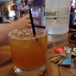 a glass of orange juice with a straw a glass of orange juice with a straw