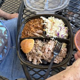 One meat plate with beans and slaw.